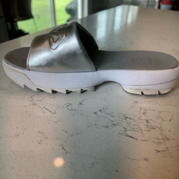 Gently used Fila Women’s disruptor sandal size 9 metallic silver and white. - Picture 3 of 4